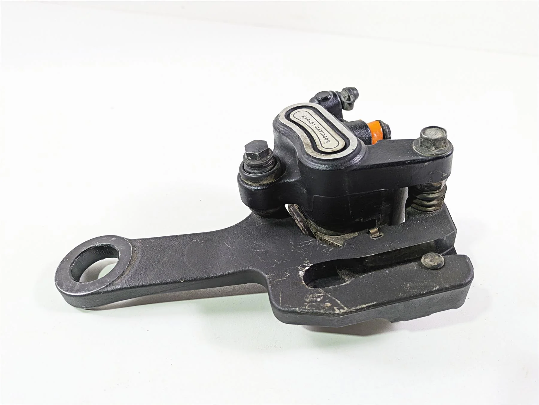 2018 Harley FLHCS Softail Heritage 115th Rear Brake Caliper & Bracket 41300192 - Image 2