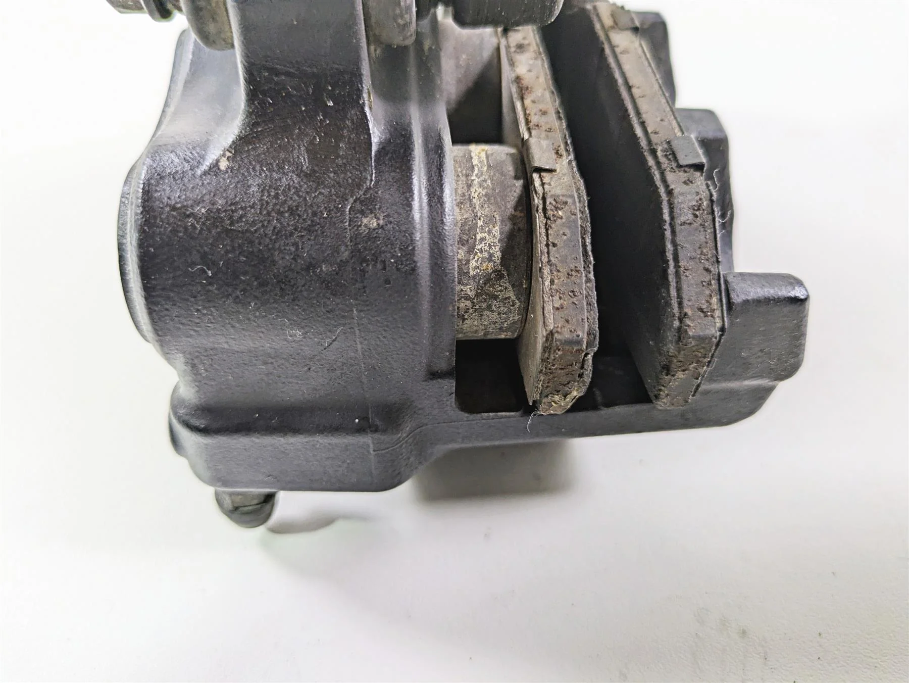 2018 Harley FLHCS Softail Heritage 115th Rear Brake Caliper & Bracket 41300192 - Image 7