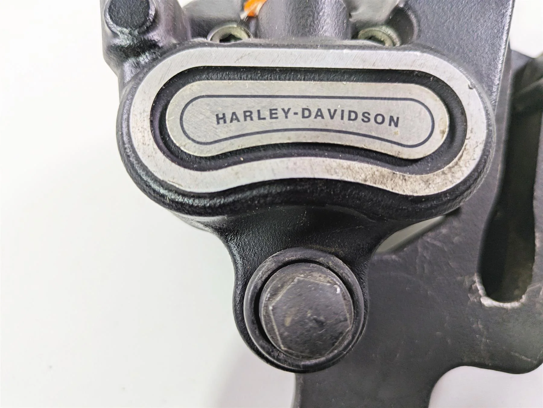 2018 Harley FLHCS Softail Heritage 115th Rear Brake Caliper & Bracket 41300192 - Image 9